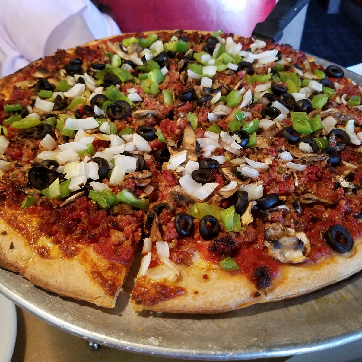 Domenico’s Belmont Shore signature dishes Veggie Pizza, Housemade Tiramisu, Giant Meatballs.